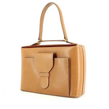 Bolso de mano en cuero color oro