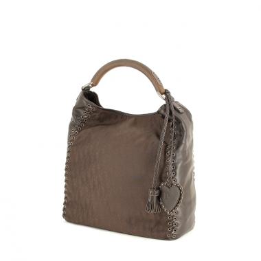 Christian Dior in brown monogram canvas and leather