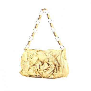 Yves Saint Laurent in gilt leather