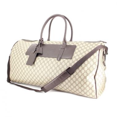 Gucci Travel bag in monogram canvas and brown leather