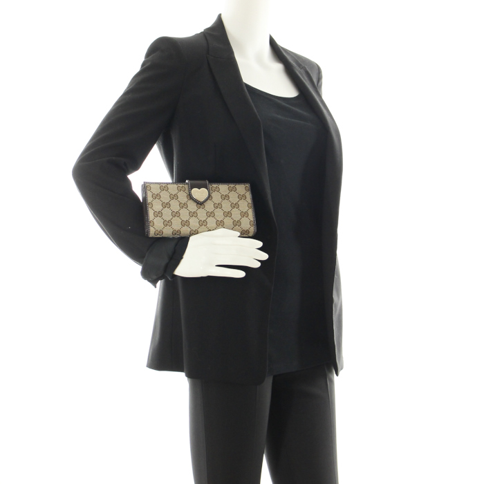 Gucci wallet in beige monogram canvas and brown leather - Detail D1