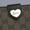 Gucci wallet in beige monogram canvas and brown leather - Detail D5 thumbnail