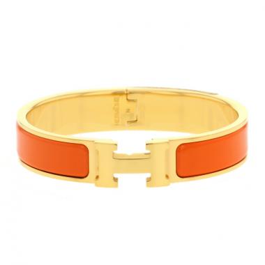 Hermès gold plated and orange enamel Clic Clac H bracelet