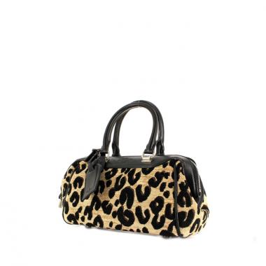 Bolso de mano en lona estampada y cuero negro