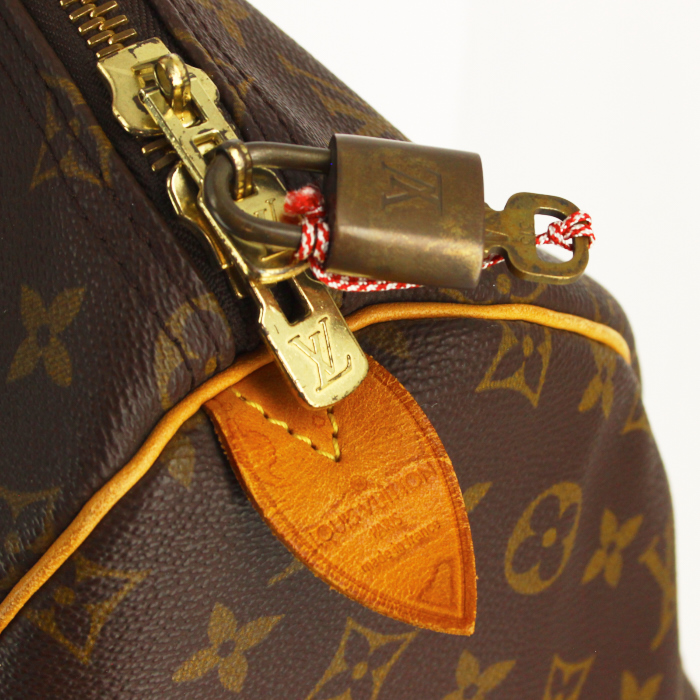 Louis Vuitton Keepall 55 cm travel bag in monogram canvas and natural leather - Detail D3