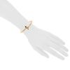 Opening Cartier Menotte bracelet in pink gold and garnets - Detail D1 thumbnail