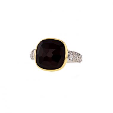 Bague Pomellato Capri en or jaune,  or blanc et diamants et en grenat rouge