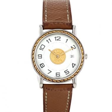 Montre Hermes Sellier - wristwatch en or et acier Vers  1990