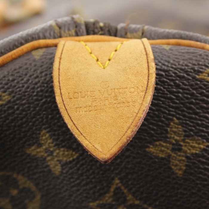 Louis Vuitton Keepall 55 cm travel bag in monogram canvas and natural leather - Detail D4