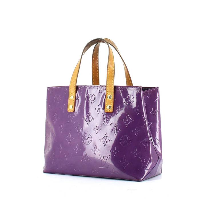 LOUIS VUITTON purple and gold monogram patent leather bag on a