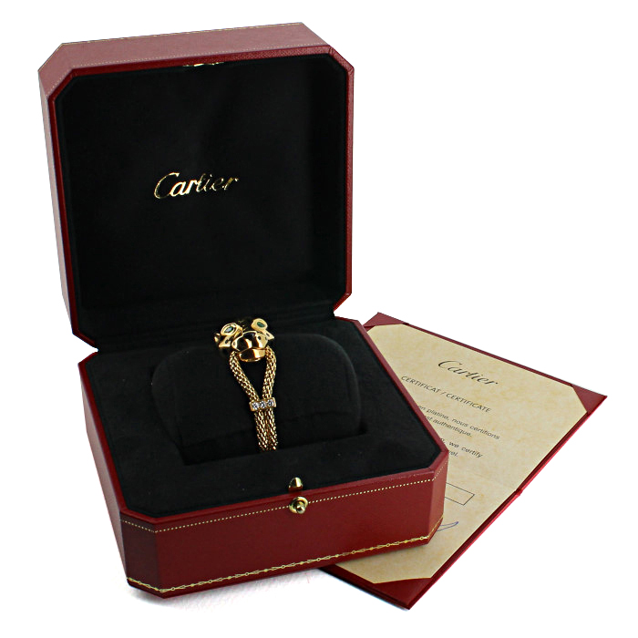 Bracelet Cartier Panthère en or jaune,  émail noir et diamants et en émeraudes