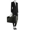 Bolsa de viaje Gucci Gucci Bagage modelo mediano en lona negra y charol negro - Detail D1 thumbnail