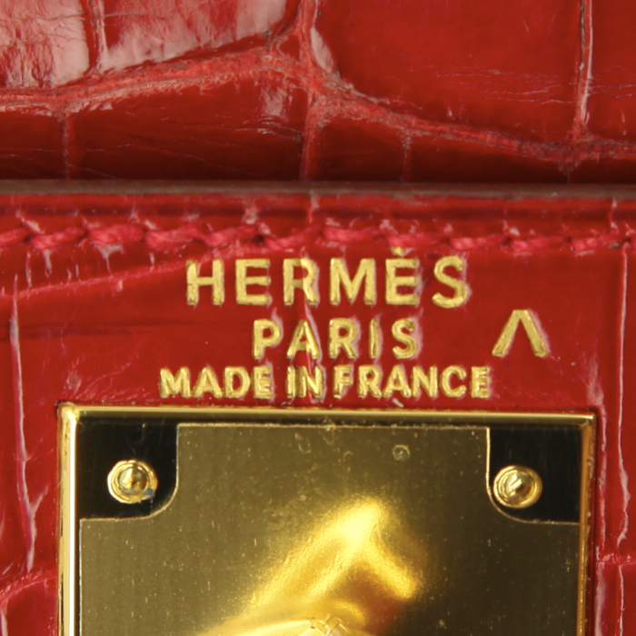 HERMES Kelly 28 cm cuir rouge braise avec anse tirette, clochette, traces stylos à l'intérieur, reteinte?  - Detail D4
