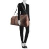 Louis Vuitton Keepall 55 cm travel bag in monogram canvas and black leather - Detail D1 thumbnail