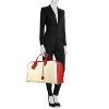 Hermes Victoria travel bag in beige canvas and red leather - Detail D1 thumbnail