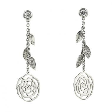 Chanel Camelia pendants earrings in white gold and diamonds
