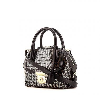 Bolso bandolera Salvatore Ferragamo Fiamma modelo pequeño en perla bicolor negra y dorada y cuero negro