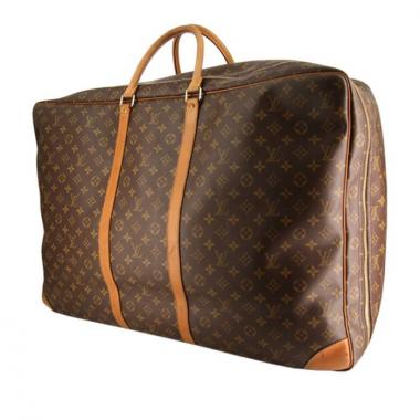 Borsa da viaggio Louis Vuitton Sirius in tela monogram cerata e pelle naturale