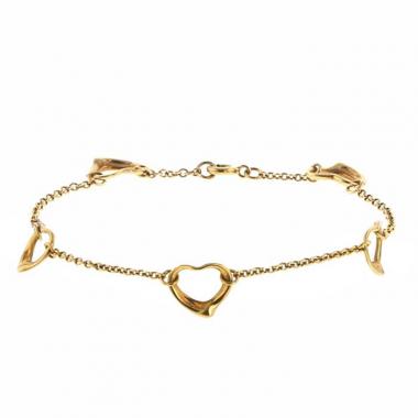 Flexible Tiffany 
Co Open Heart bracelet in yellow gold