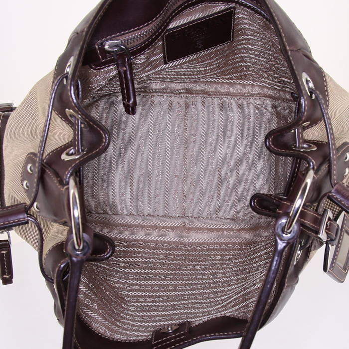 Prada Jacquard bag worn on the shoulder or carried in the hand in khaki logo canvas and dark brown leather - Detail D2