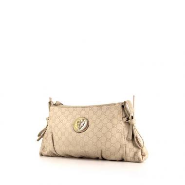 Bolsito de mano Gucci en cuero Monogram beige