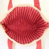 Shopping bag Louis Vuitton Antigua media in tela ecru e rossa con motivo forato - Detail D5 thumbnail