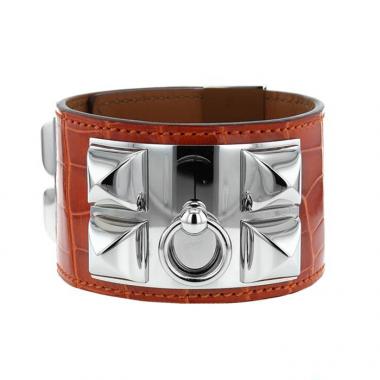 Brazalete Hermes Médor en paladio y cuero naranja