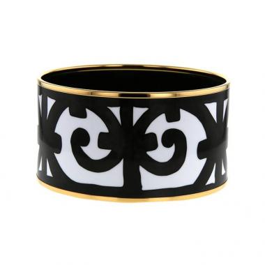 Bracelet manchette Hermès Balcon du Guadalquivir en métal doré,  émail blanc et émail noir
