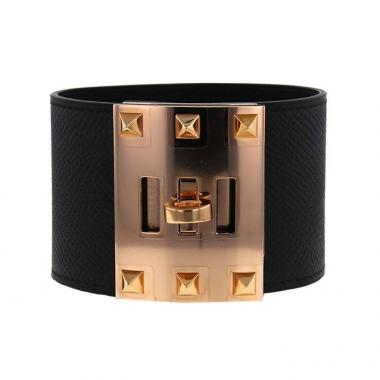 Brazalete Hermès Extrême modelo grande en cuero negro y oro chapado