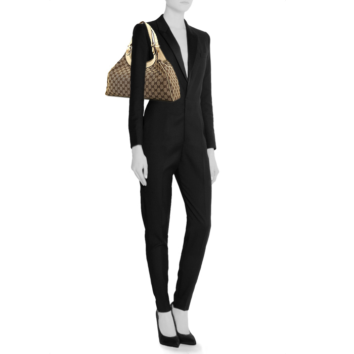 Gucci Charmy bag worn on the shoulder or carried in the hand in beige monogram canvas and cream color leather - Detail D1