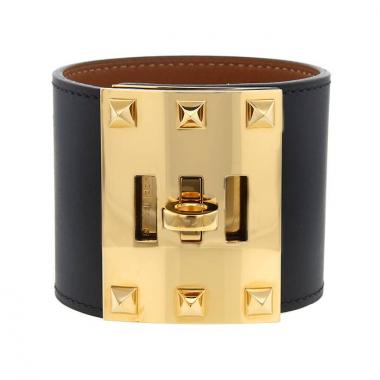 Brazalete Hermès Extrême en metal dorado y cuero