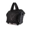 Bolsa de viaje Chanel Coco Cocoon en lona acolchada negra y cuero negro - 00pp thumbnail