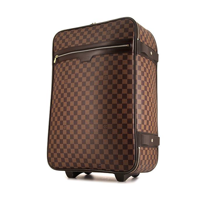 Louis VUITTON : Petite valise en cuir et toile chiffrée. Elle