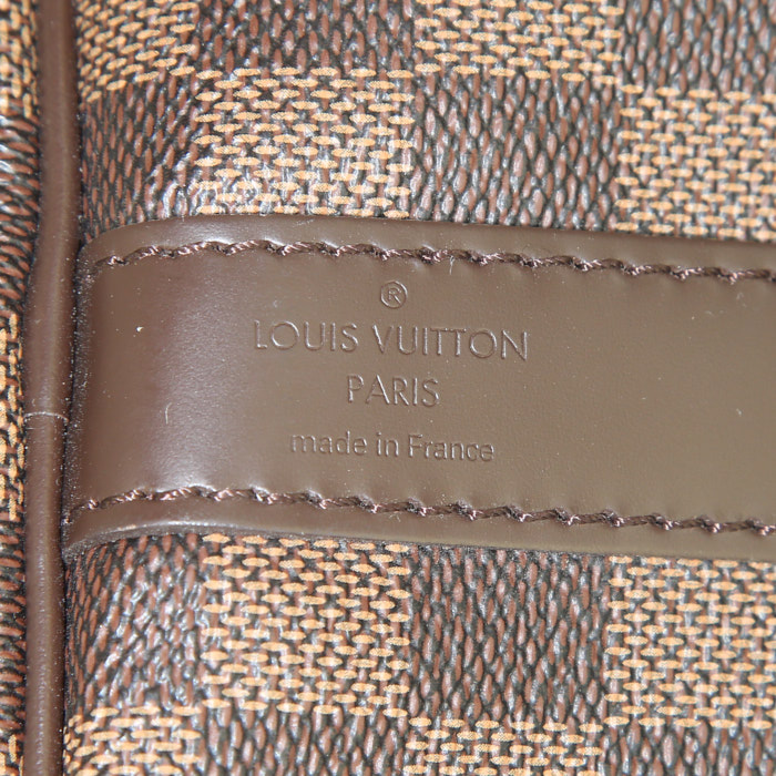 Louis Vuitton Keepall 55 cm travel bag in ebene damier canvas and brown leather - Detail D4