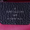 Louis Vuitton Capucines small model handbag in dark blue grained leather and pink piping - Detail D3 thumbnail