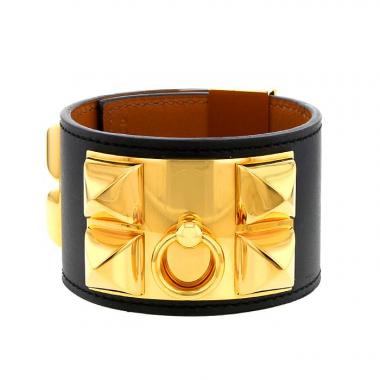 Brazalete Hermes Médor en metal dorado y cuero negro