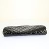 Chanel pouch in black patent quilted leather - Detail D4 thumbnail