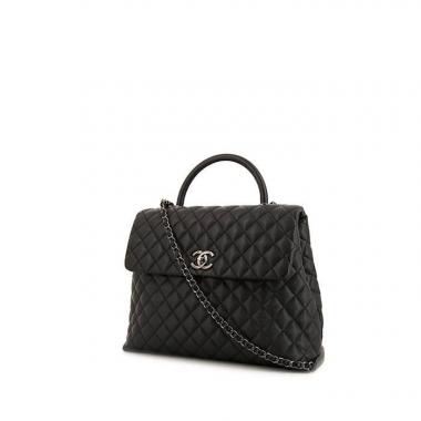 Bolso de mano Chanel Top Handle en cuero granulado acolchado negro
