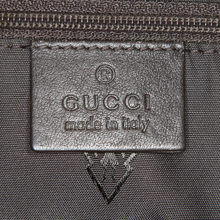 Gucci shoulder bag in brown empreinte monogram leather - Detail D3