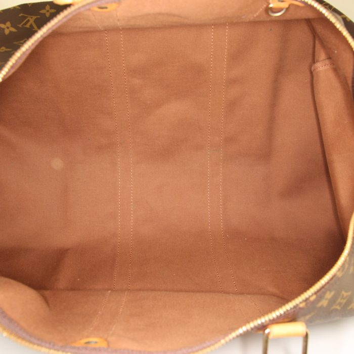 Louis Vuitton Keepall 55 cm travel bag in brown monogram canvas and natural leather - Detail D2