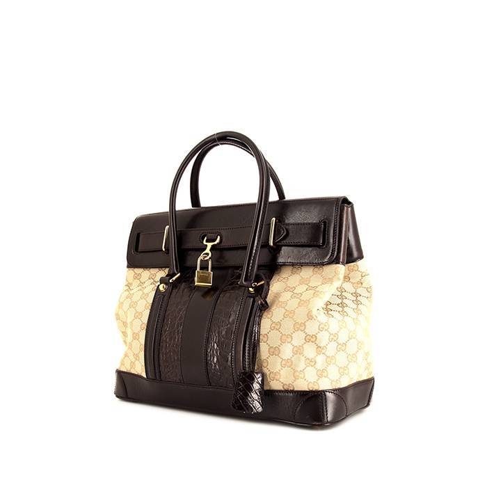 Woman with Louis Vuitton black crocodile leather bag before Gucci