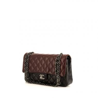 Chanel Timeless Classic bag worn on the shoulder or carried in the hand in burgundy, brown and black tricolor quilted leather
