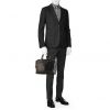 Louis Vuitton Voyage briefcase in black taiga leather and black leather - Detail D1 thumbnail