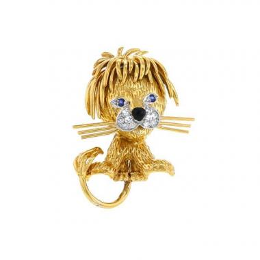 Broche-colgante Van Cleef 
Arpels Lion Ebouriffé modelo pequeño en oro amarillo,  platino y zafiros y en diamantes