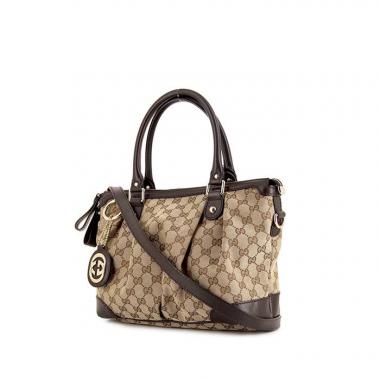 Bolso de mano Gucci Sukey modelo mediano en lona Monogram beige y cuero marrón