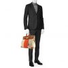 Bolsa de viaje Hermes Haut à Courroies - Travel Bag en lona bicolor beige y naranja y cuero natural - Detail D1 thumbnail