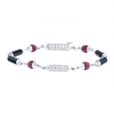 Brazalete Cartier Le Baiser du Dragon en oro blanco,  ónix y rubíes y en diamantes