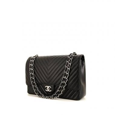 Chanel Timeless Maxi Jumbo handbag in black chevron quilted leather