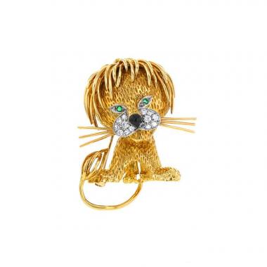 Broche-colgante época años 60 Van Cleef 
Arpels Lion Ebouriffé modelo grande en oro amarillo,  platino y diamantes, en esmeralda y en ónix