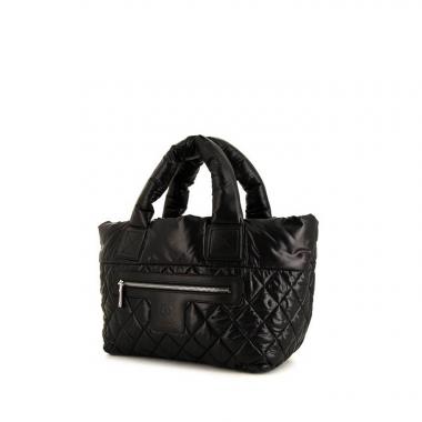 Bolso de mano Chanel Coco Cocoon en lona acolchada negra y cuero negro